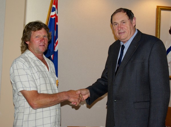 Garry Langridge�s 15 years of service to the Ararua Volunteer Rural Fire Force is acknowledged by Kaipara Mayor Neil Tiller
